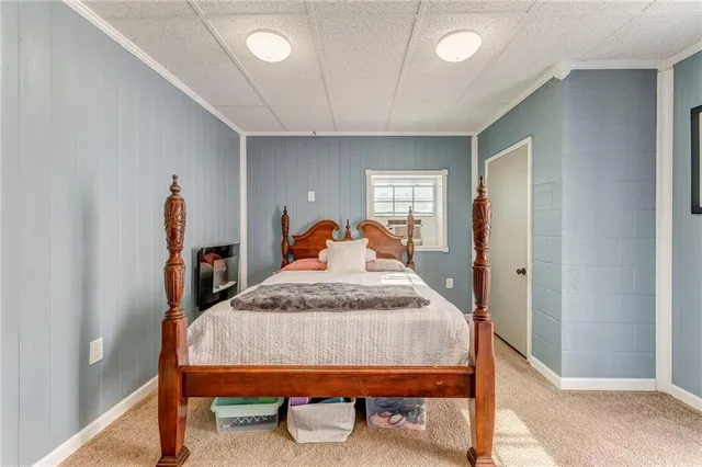 a bedroom with bed and window