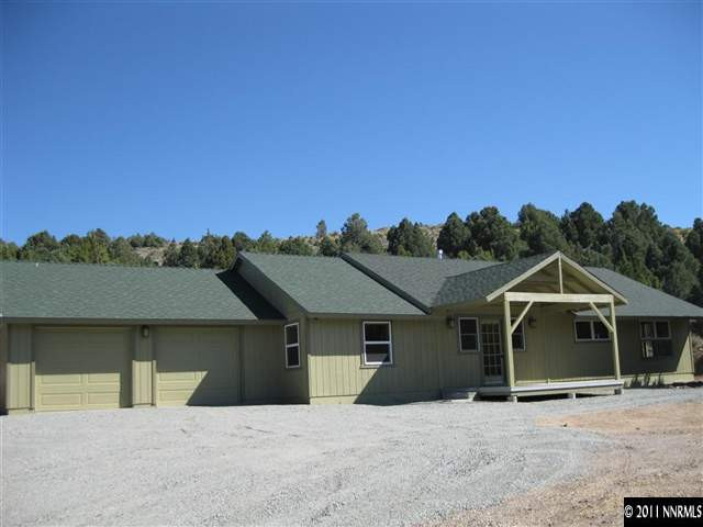 2830 Goldfield Road Reno, NV 89521 - Photo 1 of 13 a front view of a house with a yard