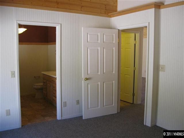 2830 Goldfield Road Reno, NV 89521 - Photo 6 of 13 a view of a bathroom with a glass door and a bathroom