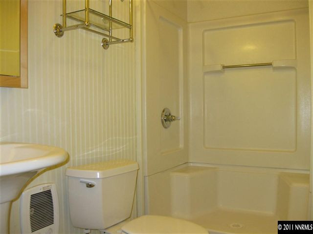 2830 Goldfield Road Reno, NV 89521 - Photo 8 of 13 a bathroom with a sink a toilet and shower