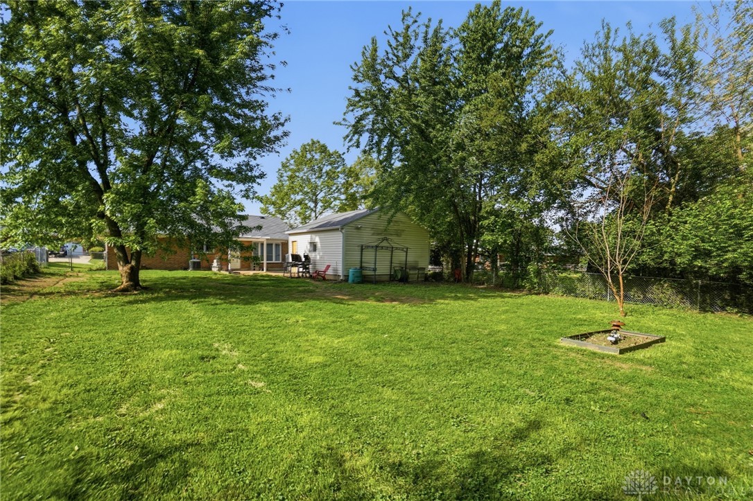 629 Storms Road Dayton, OH 45429 - Photo 46 of 51 This spacious yard offers ample green space and a serene outdoor retreat.