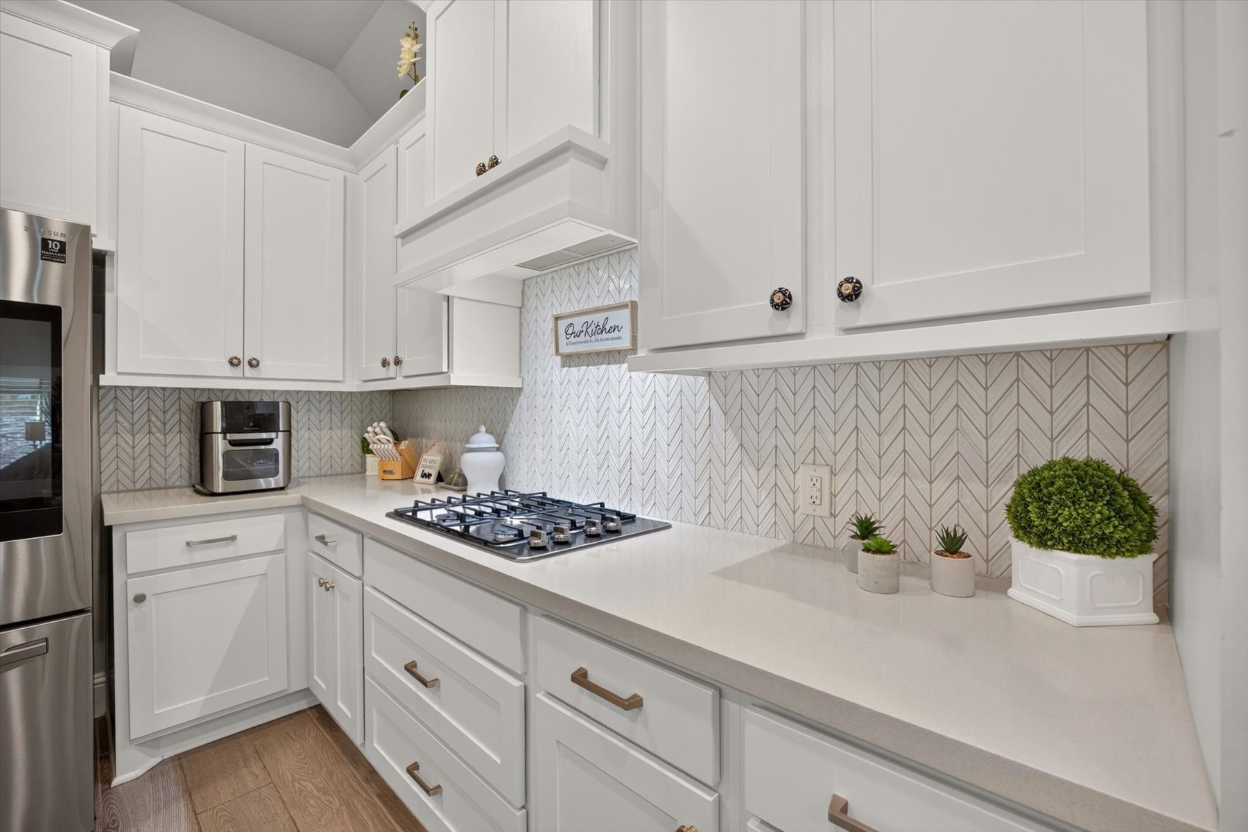 23026 Needle Grass Road Katy, TX 77493 - Photo 11 of 33 Granite countertops, modern tile backsplash, and plenty of workspace.