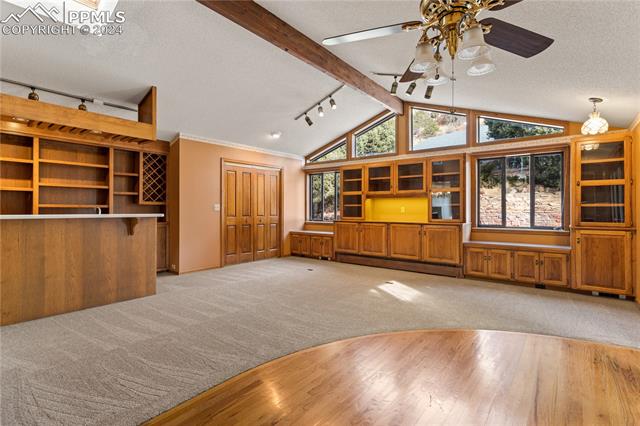 2675 North Chelton Road Colorado Springs, CO 80909 - Photo 9 of 30 Family Room w/Built-ins and Wet Bar