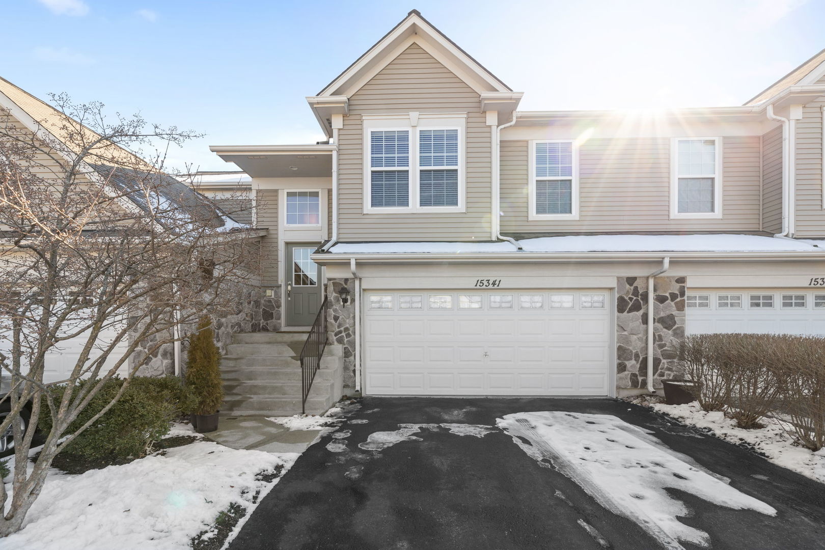 15341 Pinewood Road, Unit 15341 Lockport, IL 60441 - Photo 1 of 21 a front view of a house with a yard