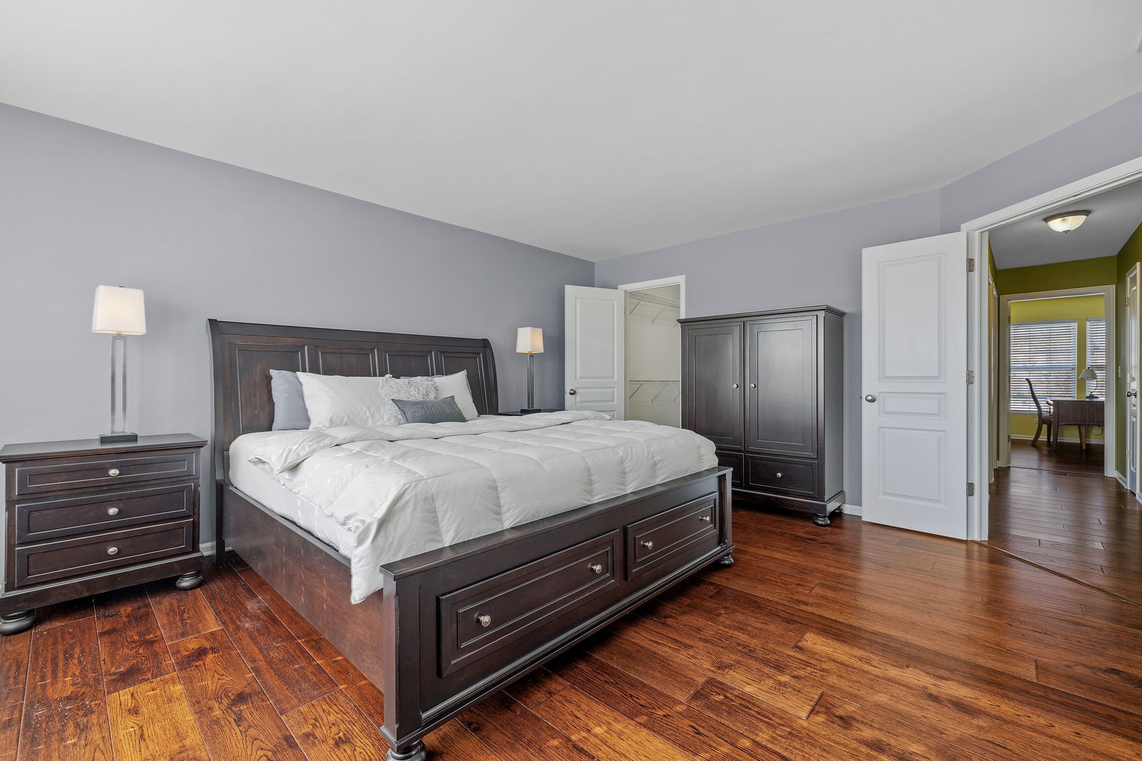15341 Pinewood Road, Unit 15341 Lockport, IL 60441 - Photo 11 of 21 a spacious bedroom with a bed and wooden floor