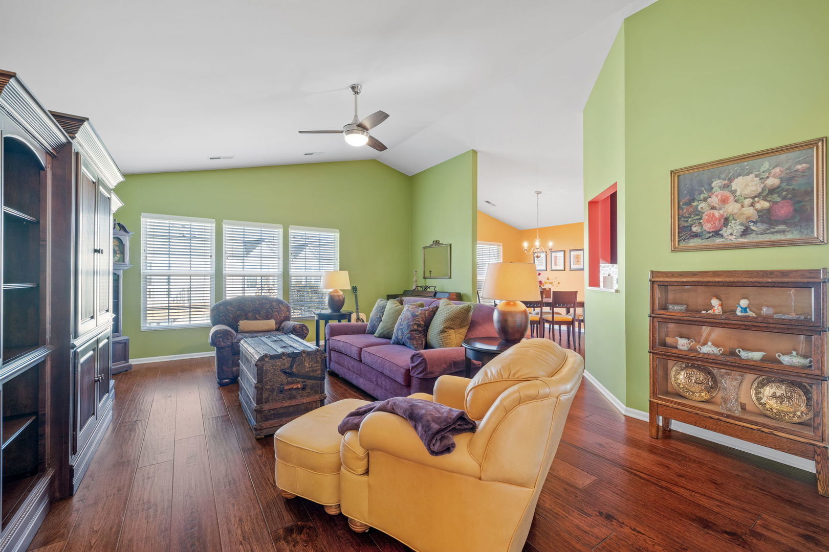 15341 Pinewood Road, Unit 15341 Lockport, IL 60441 - Photo 2 of 21 a living room with furniture a wooden floor and a large window