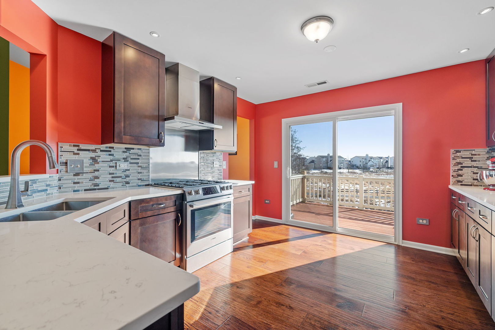 15341 Pinewood Road, Unit 15341 Lockport, IL 60441 - Photo 5 of 21 a kitchen with stainless steel appliances granite countertop a stove a sink dishwasher and a refrigerator with wooden floor