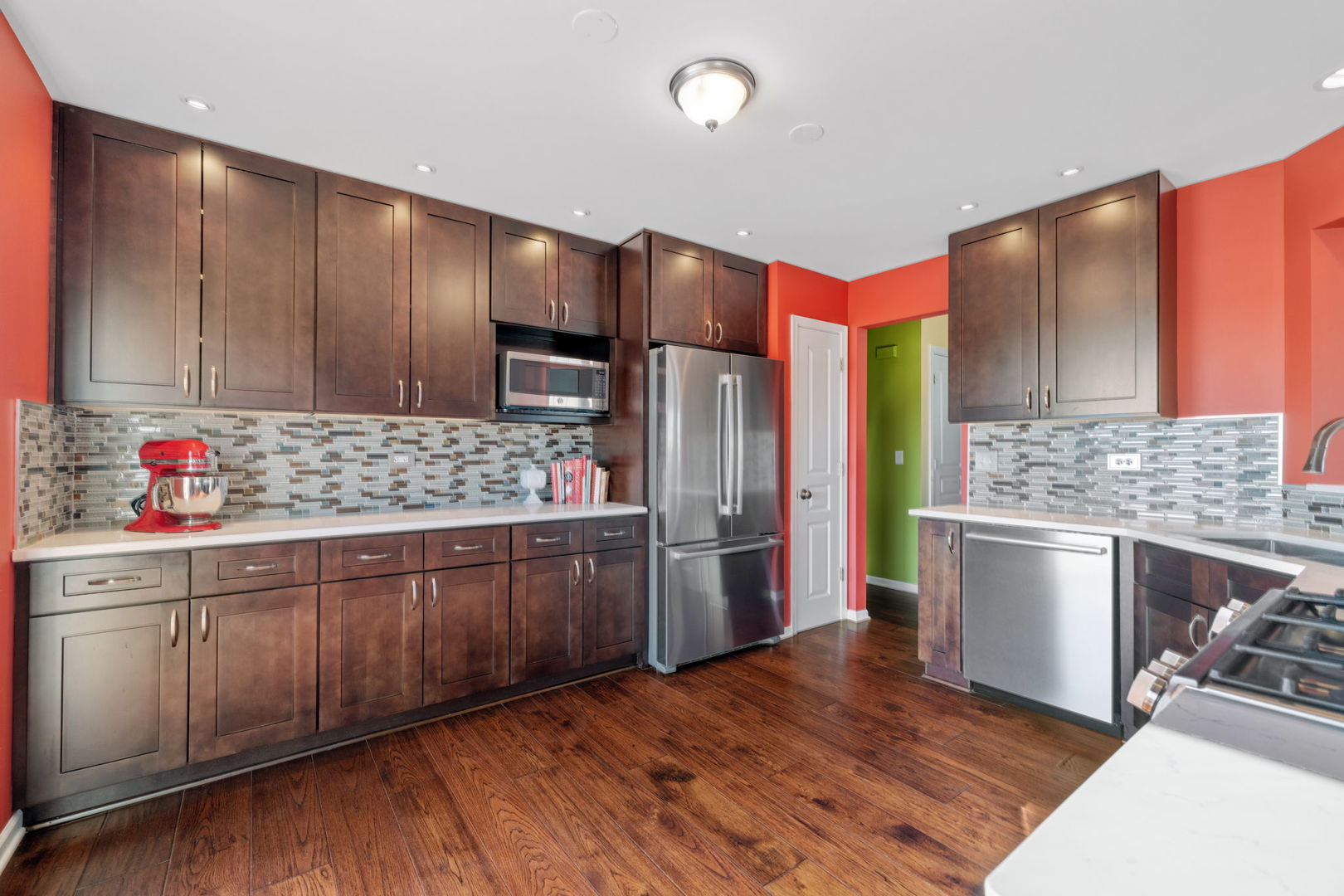 15341 Pinewood Road, Unit 15341 Lockport, IL 60441 - Photo 8 of 21 a kitchen with stainless steel appliances kitchen island granite countertop a refrigerator and a stove top oven