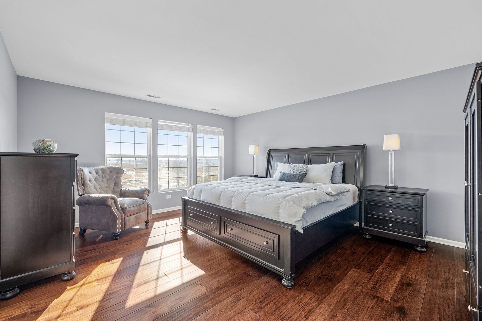 15341 Pinewood Road, Unit 15341 Lockport, IL 60441 - Photo 10 of 21 a bedroom with a bed and wooden floor