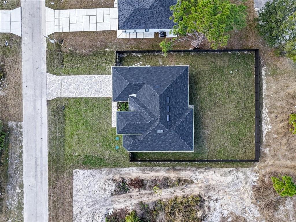 3812 9th Street Southwest Lehigh Acres, FL 33976 - Photo 36 of 39 a aerial view of a house with a yard