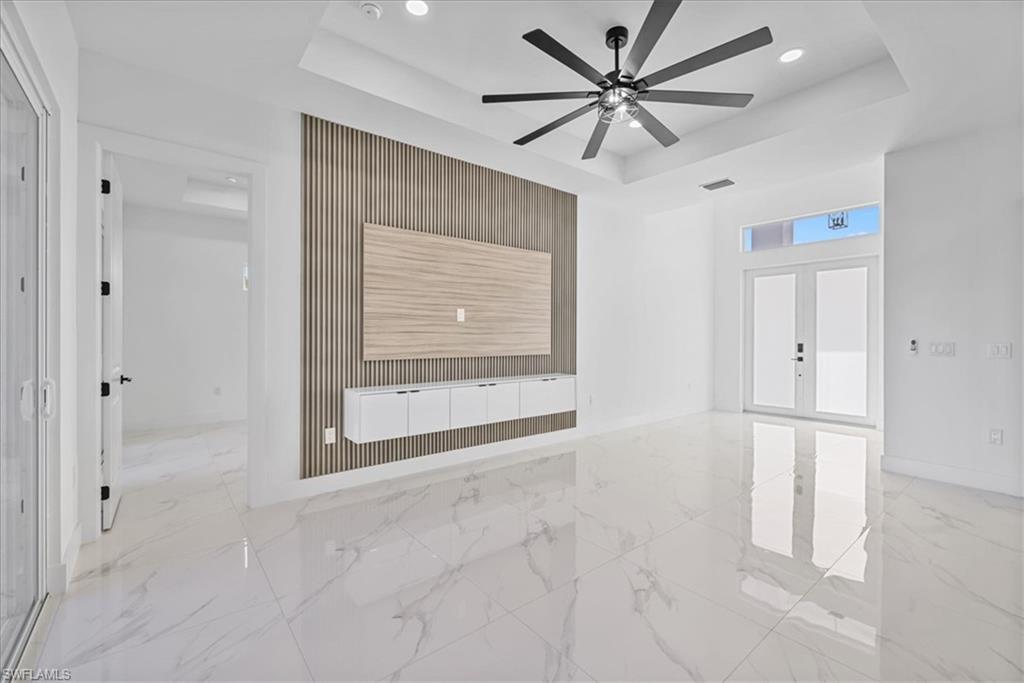 3812 9th Street Southwest Lehigh Acres, FL 33976 - Photo 4 of 39 a view of an empty room with a window