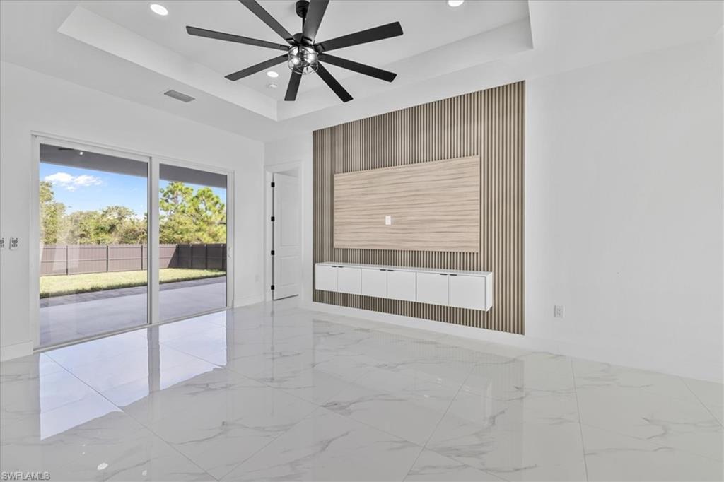 3812 9th Street Southwest Lehigh Acres, FL 33976 - Photo 5 of 39 a view of an empty room with a window