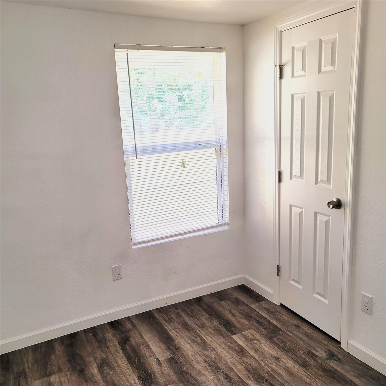 6901 Dumble Street Houston, TX 77021 - Photo 19 of 26 an empty room with wooden floor and windows