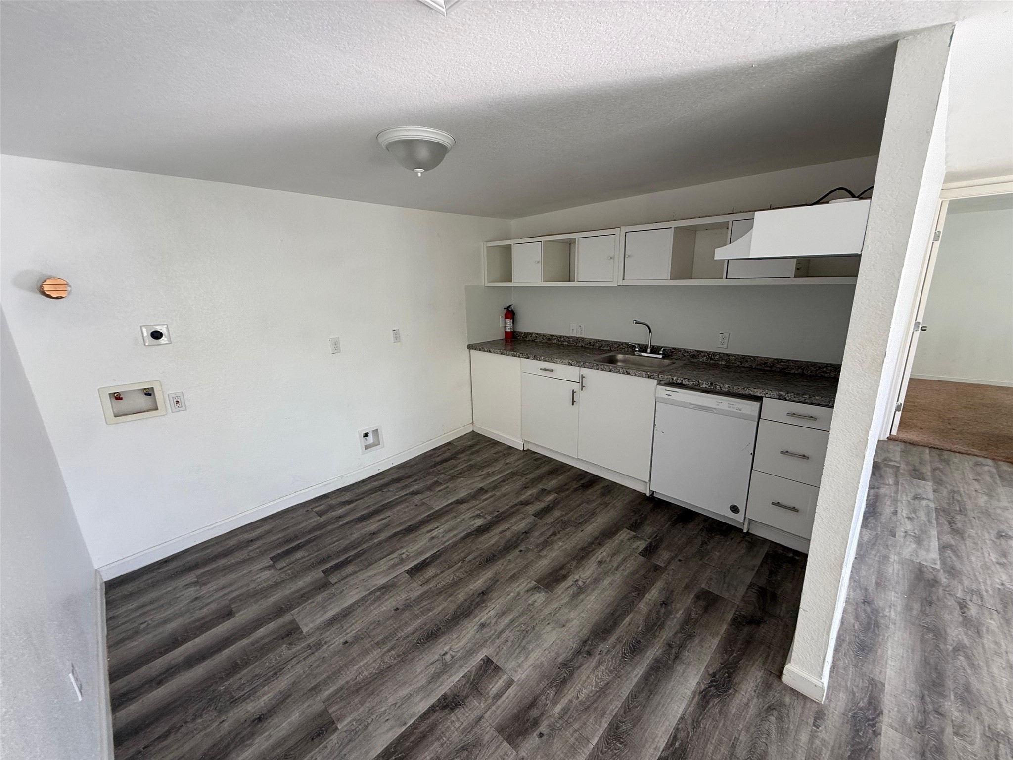 6901 Dumble Street Houston, TX 77021 - Photo 9 of 26 a kitchen with granite countertop a sink and cabinets