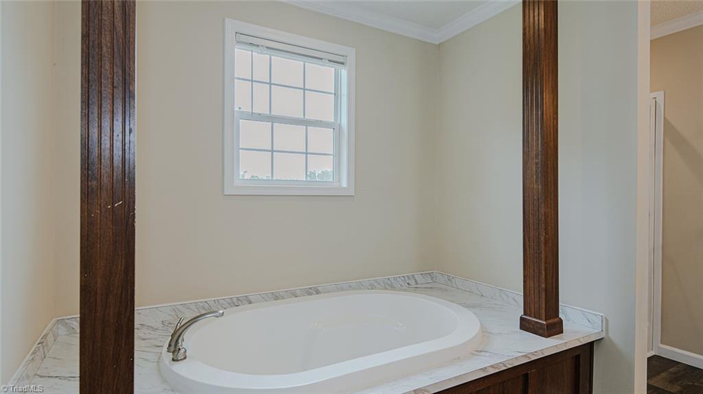 851 Chandler Mill Road Pelham, NC 27311 - Photo 30 of 46 Soaker Tub in Primary Bathroom