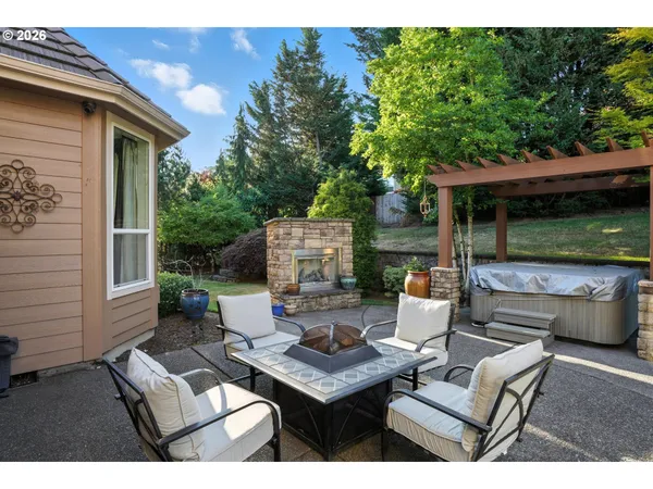 a view of backyard with outdoor seating and green space