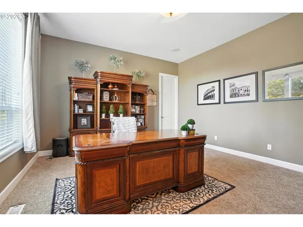 a view of a livingroom with furniture and hardwood floor