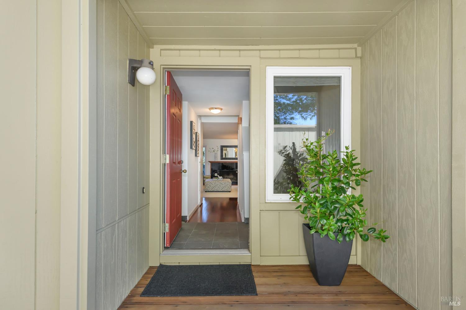 36 Schmidt Lane San Rafael, CA 94903 - Photo 6 of 31 a view of a hallway with wooden floor and a potted plant