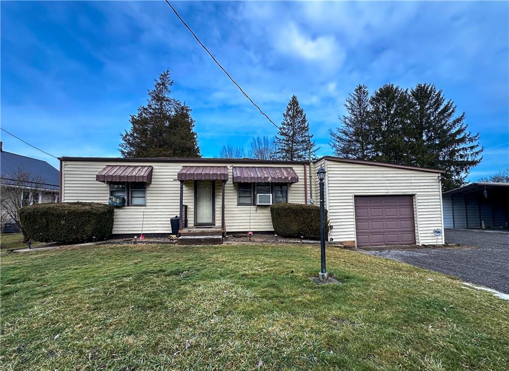 1173 Freeport Road Kittanning, PA 16201 - Photo 1 of 22 a front view of a house with a yard