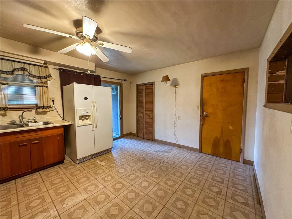 1173 Freeport Road Kittanning, PA 16201 - Photo 7 of 22 a view of a kitchen with refrigerator and cabinets
