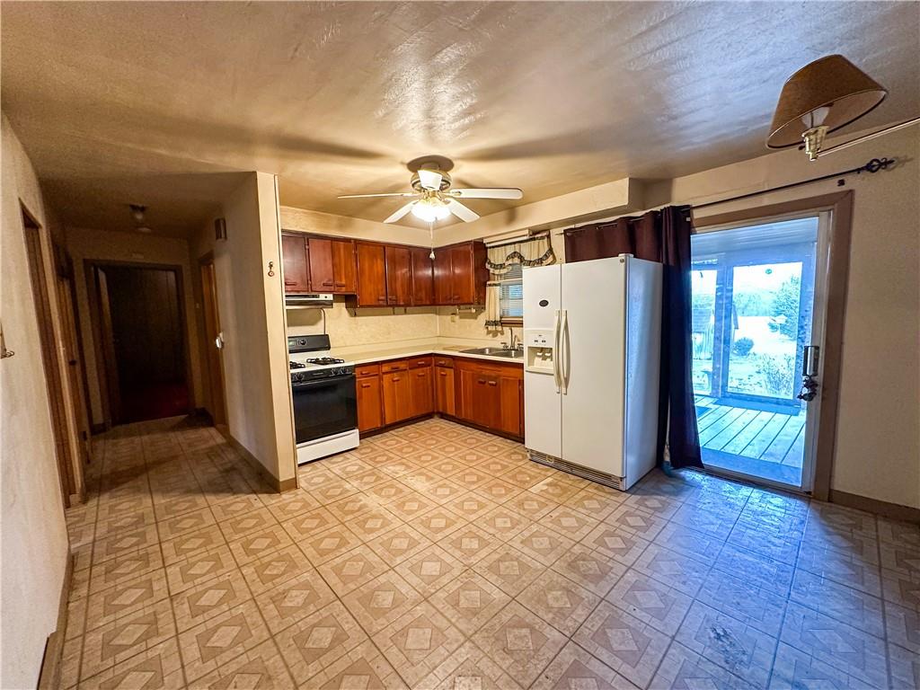 1173 Freeport Road Kittanning, PA 16201 - Photo 8 of 22 a kitchen with stainless steel appliances granite countertop a refrigerator and a sink