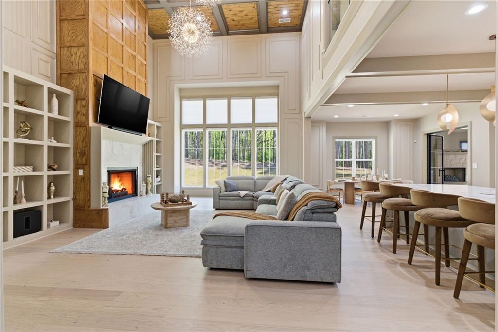 1315 Sandy Creek Road Fayetteville, GA 30214 - Photo 18 of 107 a living room with fireplace furniture and a flat screen tv