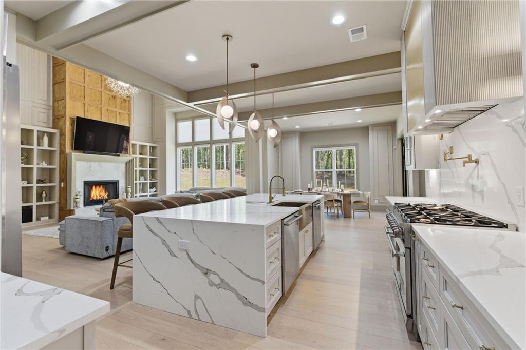 1315 Sandy Creek Road Fayetteville, GA 30214 - Photo 36 of 107 a living room with furniture a fireplace and a flat screen tv