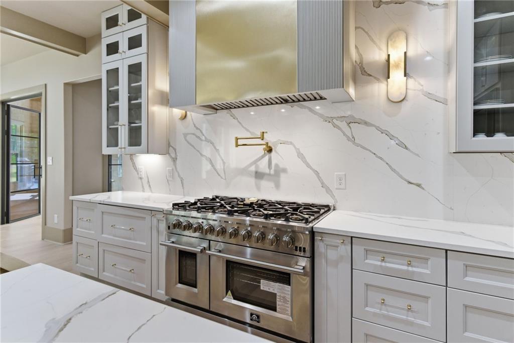 1315 Sandy Creek Road Fayetteville, GA 30214 - Photo 38 of 107 a kitchen with granite countertop stainless steel appliances and cabinets