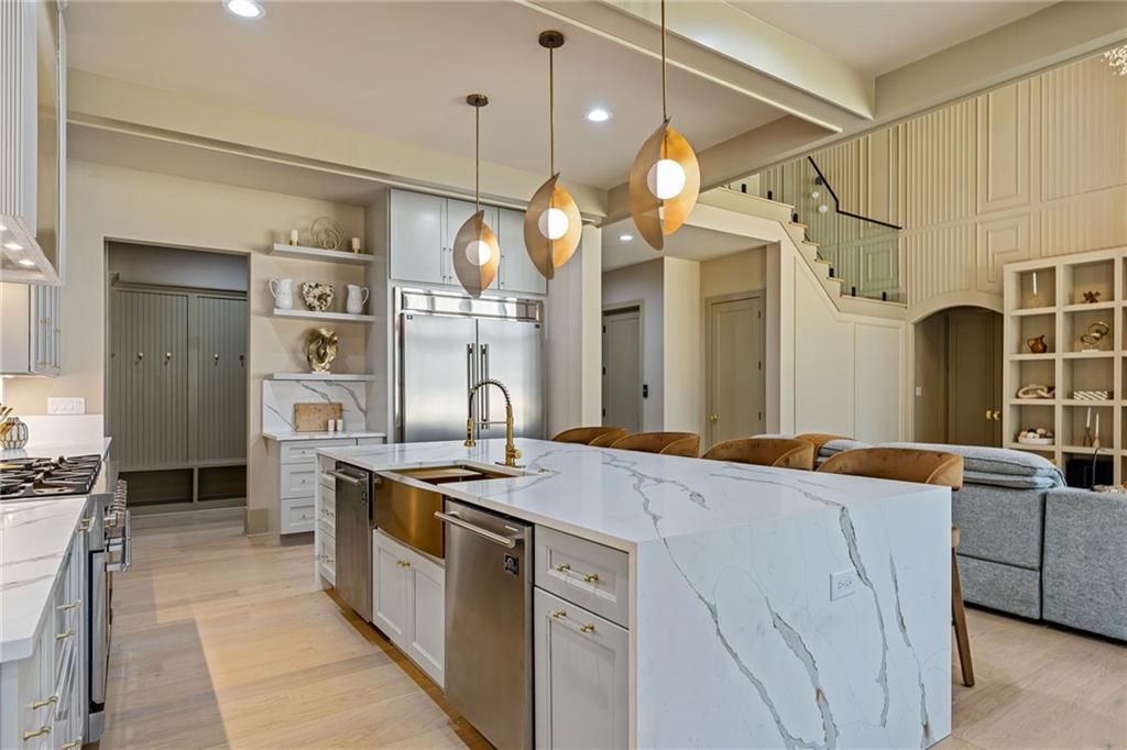 1315 Sandy Creek Road Fayetteville, GA 30214 - Photo 39 of 107 a kitchen with stainless steel appliances granite countertop a sink a stove and a refrigerator