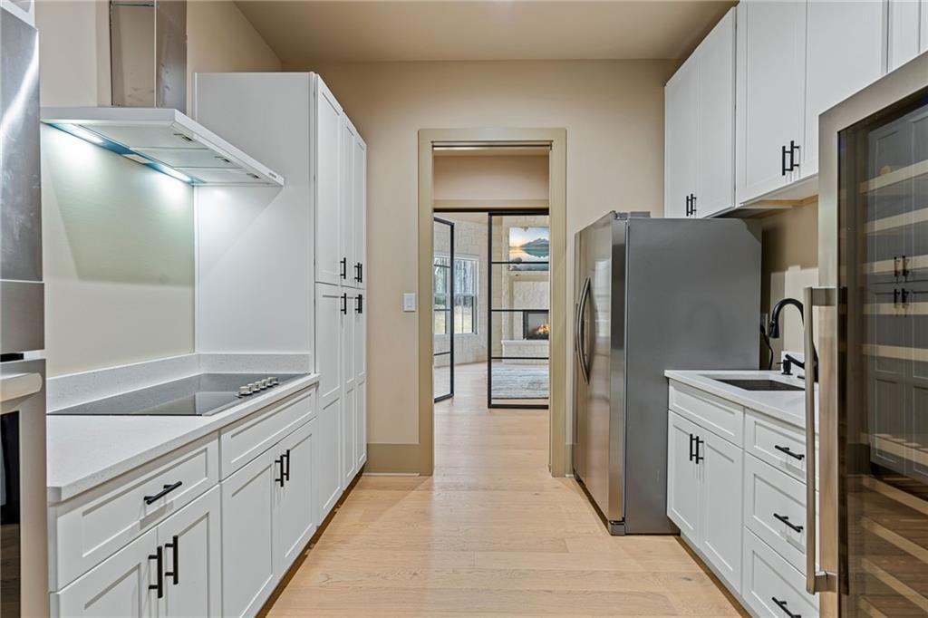 1315 Sandy Creek Road Fayetteville, GA 30214 - Photo 50 of 107 a kitchen with stainless steel appliances granite countertop a refrigerator and a sink