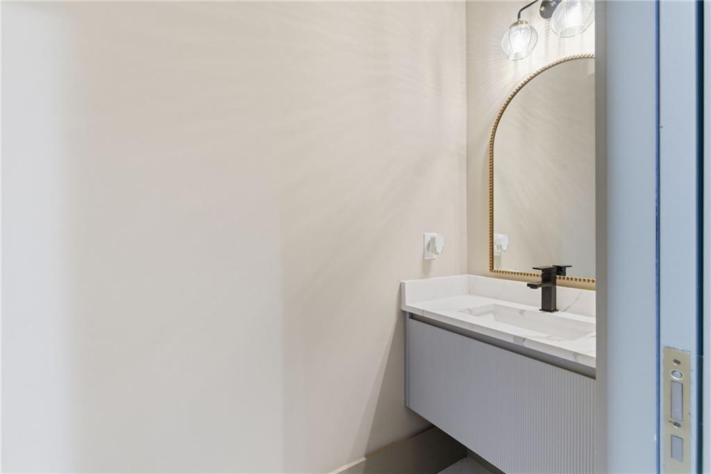 1315 Sandy Creek Road Fayetteville, GA 30214 - Photo 51 of 107 a bathroom with a sink and a mirror