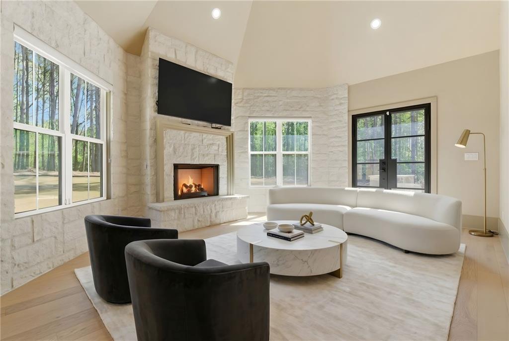 1315 Sandy Creek Road Fayetteville, GA 30214 - Photo 54 of 107 a living room with fireplace furniture and a flat screen tv
