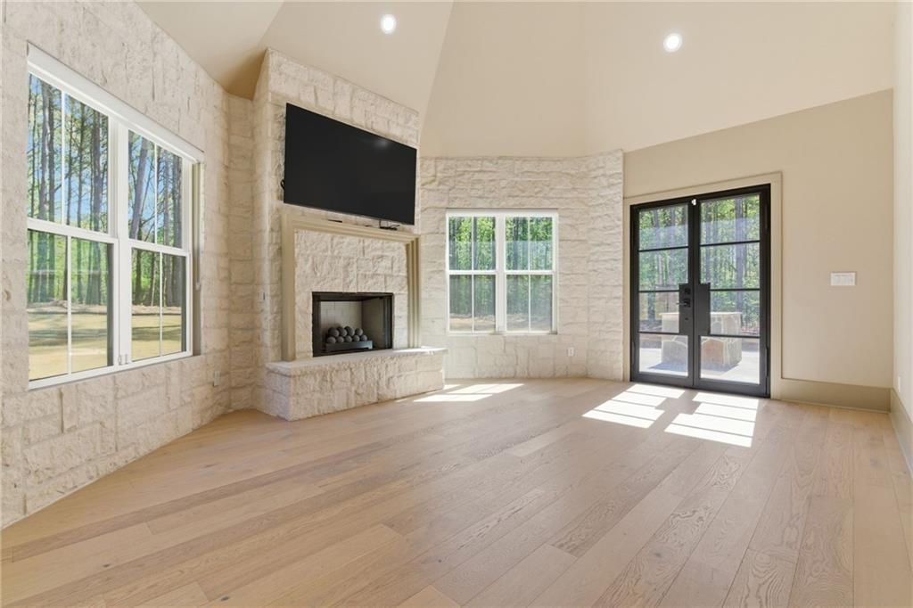 1315 Sandy Creek Road Fayetteville, GA 30214 - Photo 56 of 107 a view of an empty room with a fireplace and a window