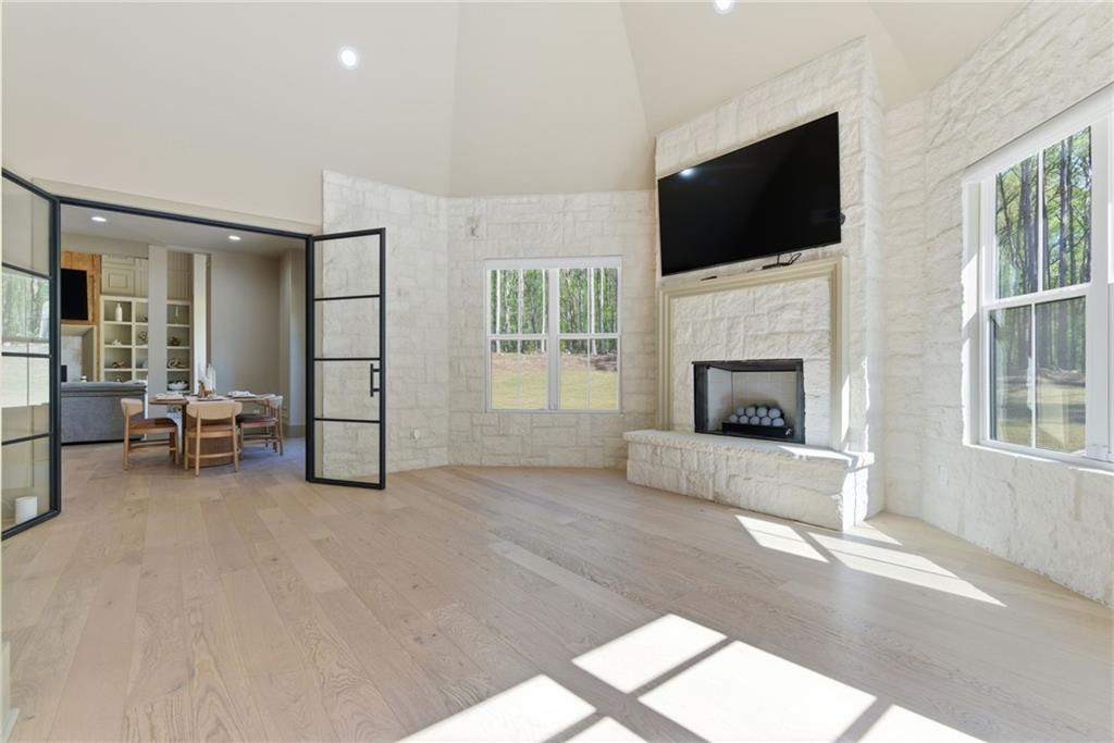 1315 Sandy Creek Road Fayetteville, GA 30214 - Photo 60 of 107 a living room with furniture and a flat screen tv