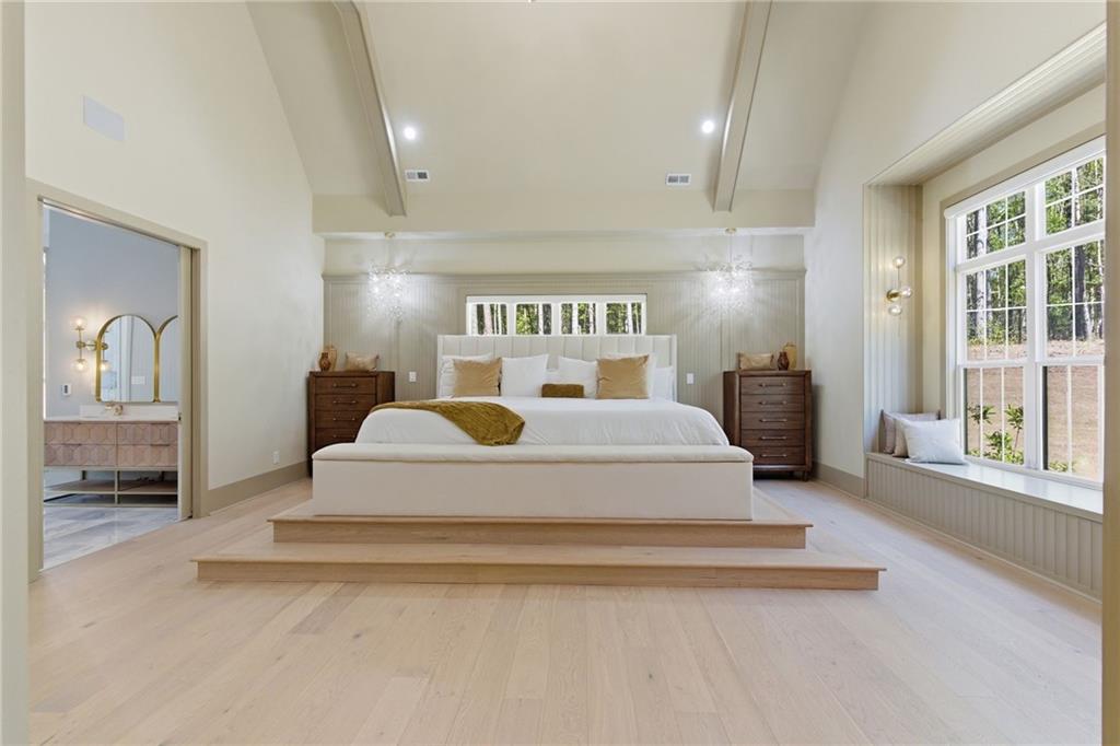 1315 Sandy Creek Road Fayetteville, GA 30214 - Photo 62 of 107 a spacious bedroom with a large bed and a window