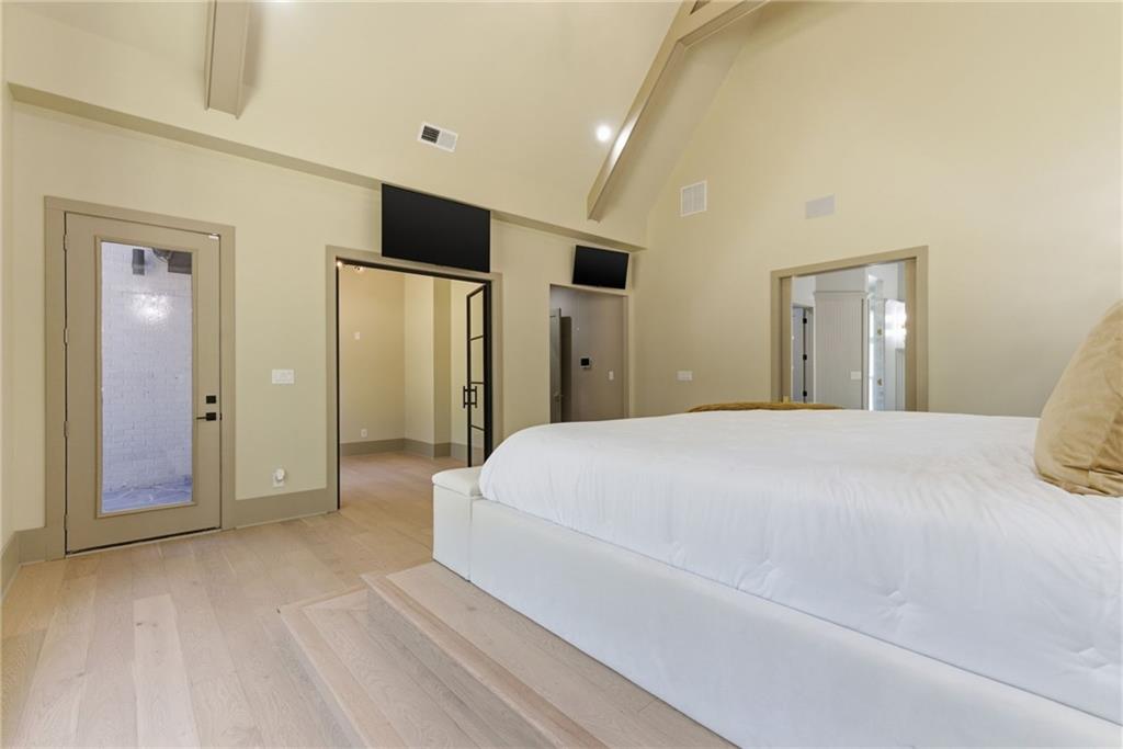 1315 Sandy Creek Road Fayetteville, GA 30214 - Photo 64 of 107 a spacious bedroom with a bed and a mirror