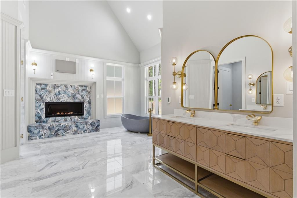1315 Sandy Creek Road Fayetteville, GA 30214 - Photo 72 of 107 a spacious bathroom with a granite countertop sink a mirror and shower