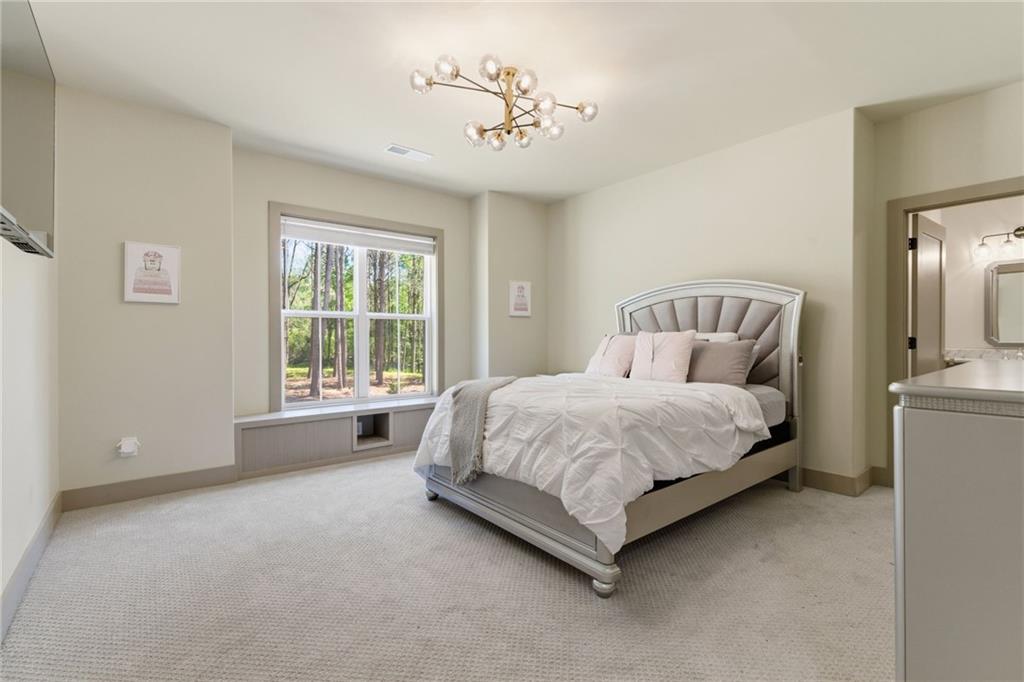 1315 Sandy Creek Road Fayetteville, GA 30214 - Photo 83 of 107 a spacious bedroom with a bed and a window