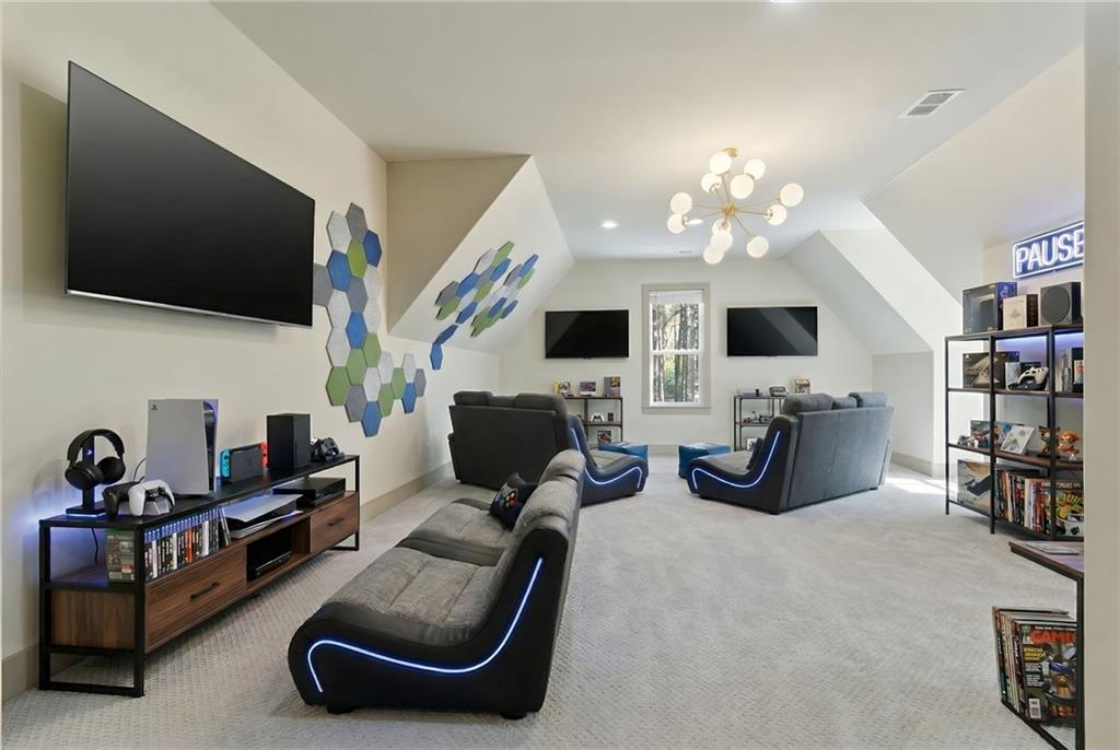 1315 Sandy Creek Road Fayetteville, GA 30214 - Photo 89 of 107 a living room with furniture and a flat screen tv