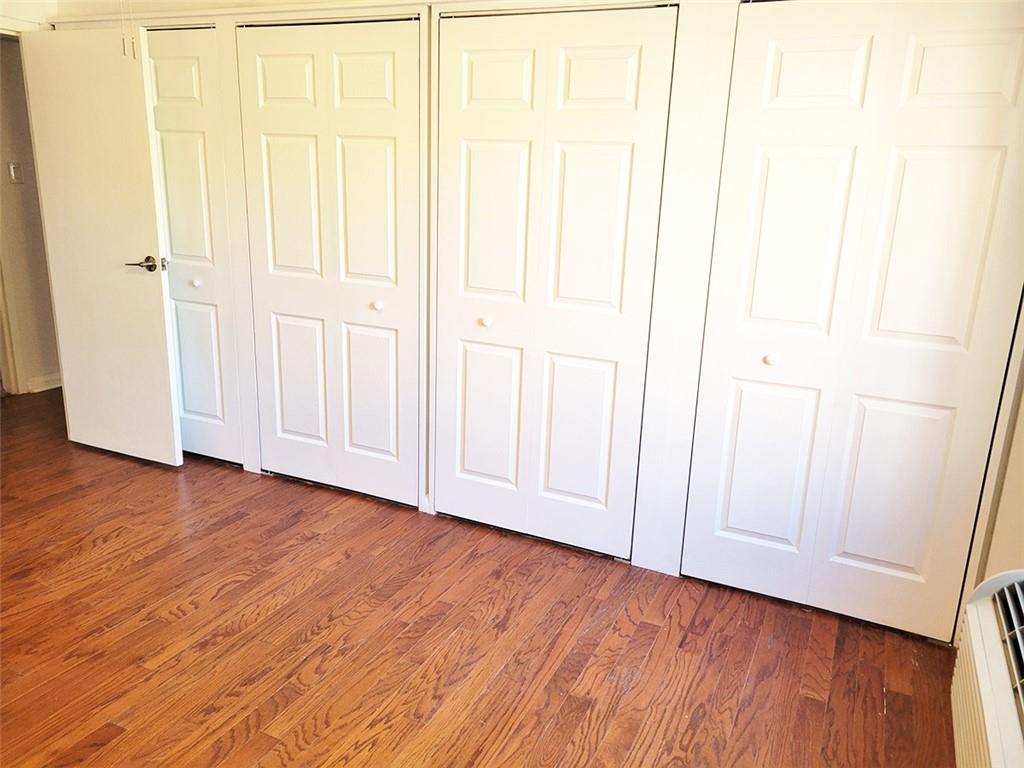 4601 Fifth Avenue, Unit 326 Pittsburgh, PA 15213 - Photo 11 of 20 an empty room with wooden floor