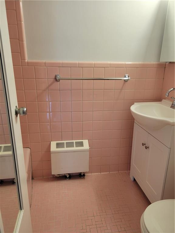 4601 Fifth Avenue, Unit 326 Pittsburgh, PA 15213 - Photo 12 of 20 a bathroom with a sink a toilet and shower