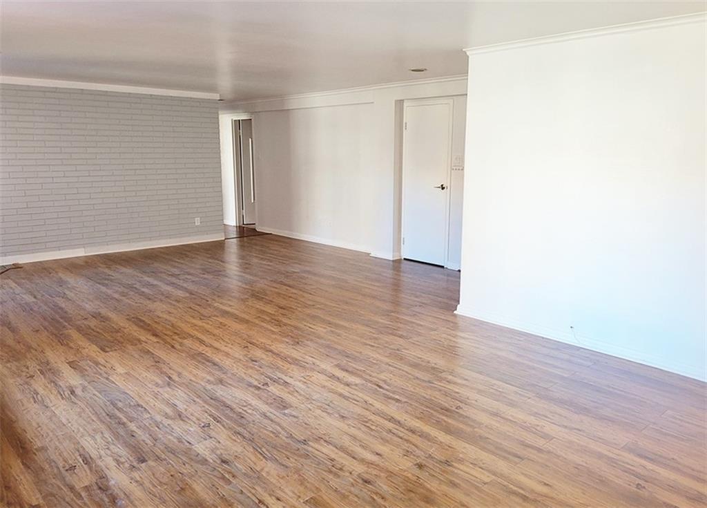 4601 Fifth Avenue, Unit 326 Pittsburgh, PA 15213 - Photo 5 of 20 an empty room with wooden floor