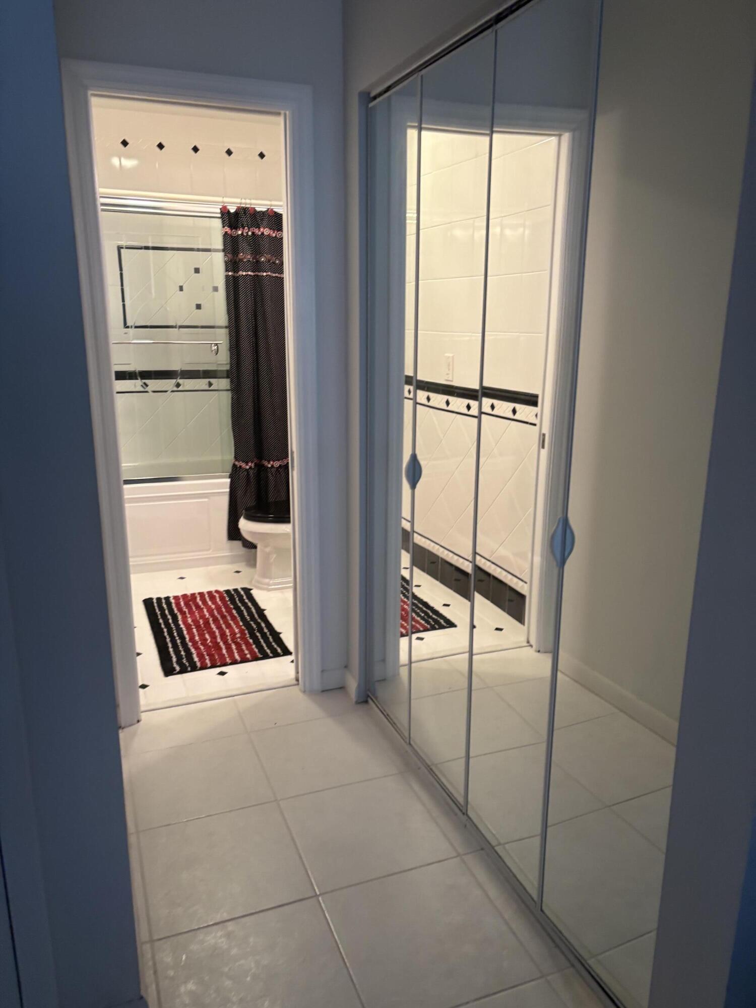 8608 Bella Vista Drive Boca Raton, FL 33433 - Photo 8 of 11 a view of walk in closet with empty racks