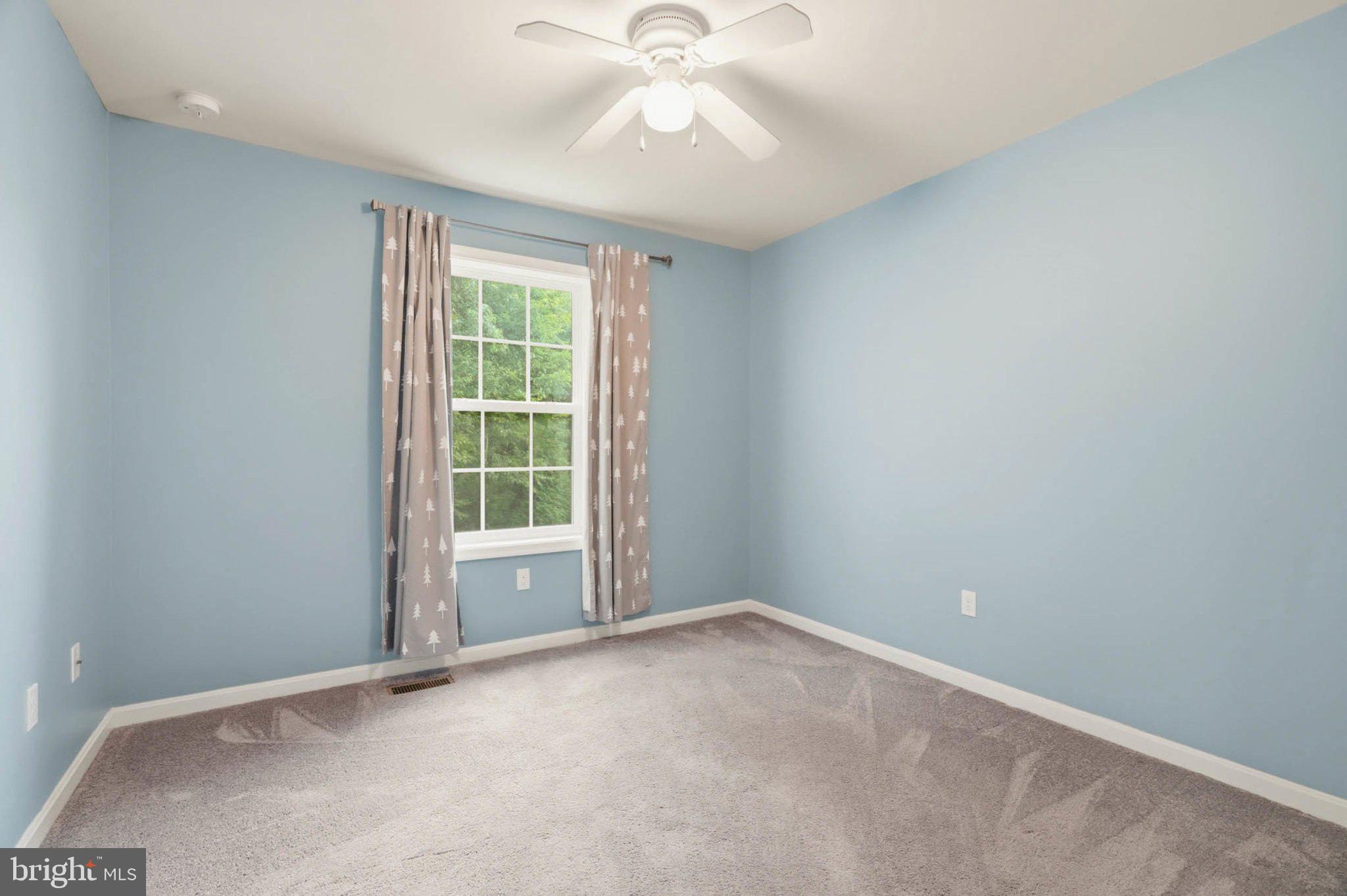 706 Trapper Way Deale, MD 20751 - Photo 34 of 61 Serene blue room with natural light.
