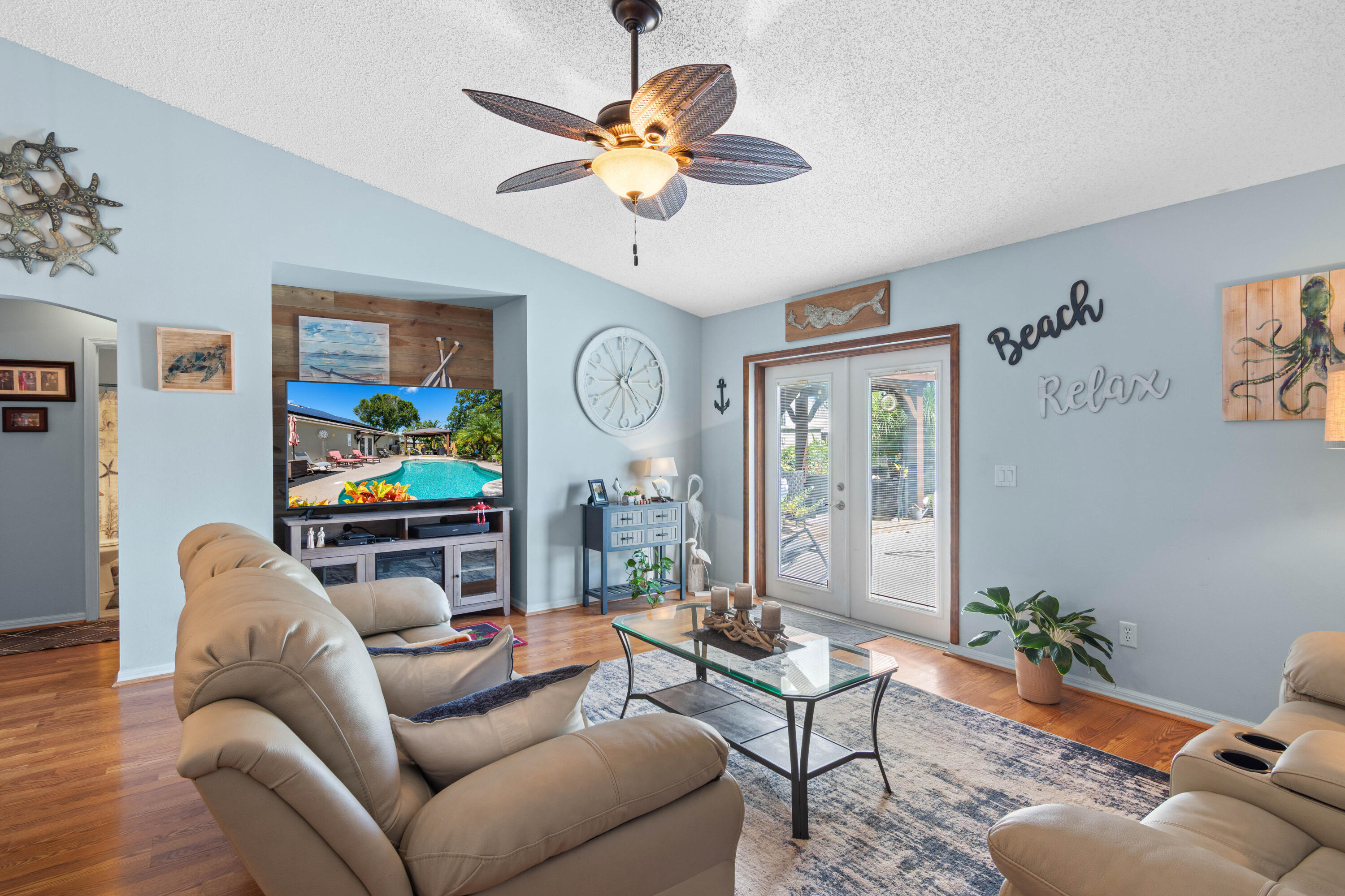 1817 Southwest Davis Street Port St. Lucie, FL 34953 - Photo 11 of 52 a living room with furniture and a chandelier