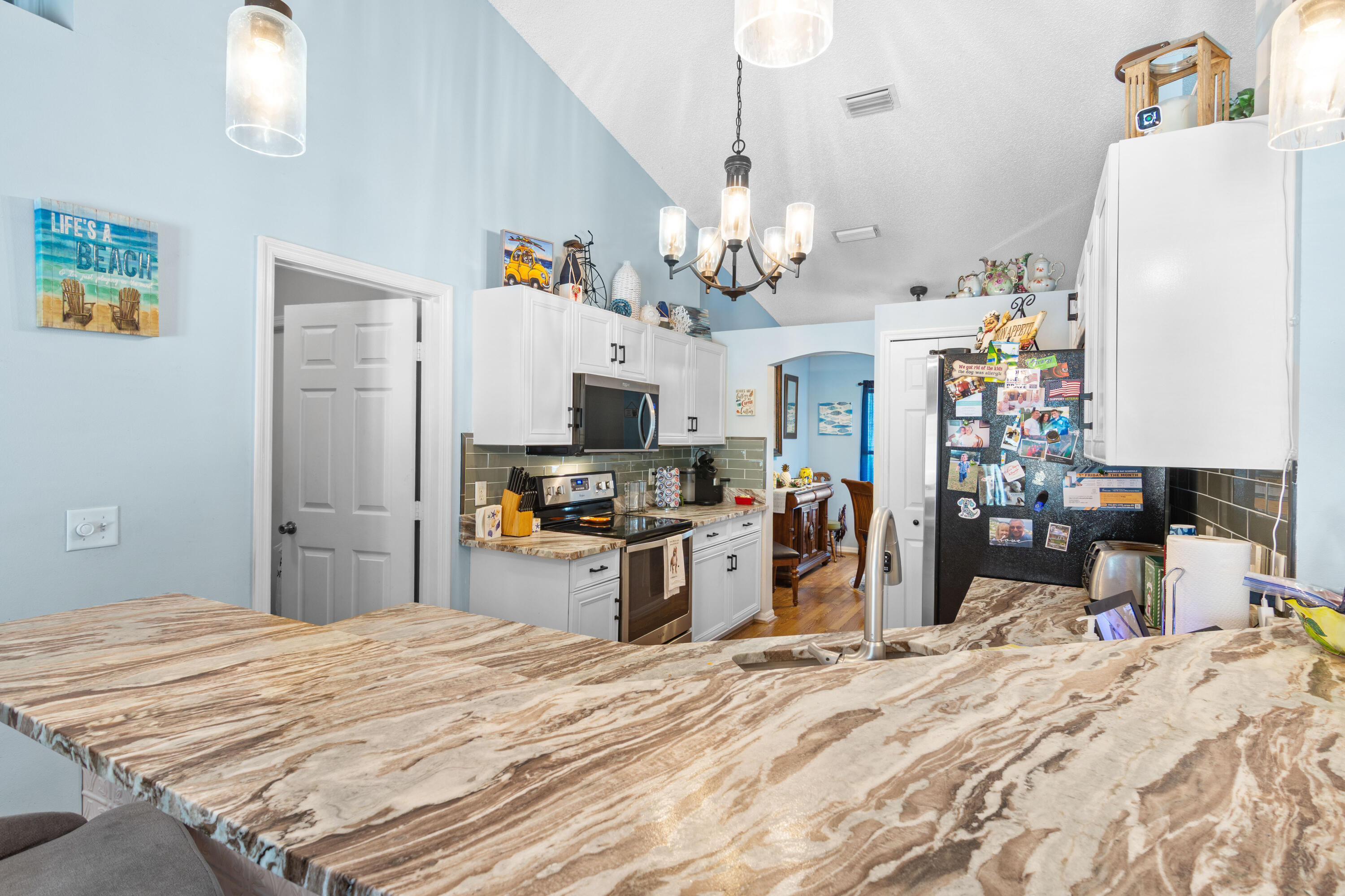 1817 Southwest Davis Street Port St. Lucie, FL 34953 - Photo 13 of 52 a bed room with a bed and a television in it