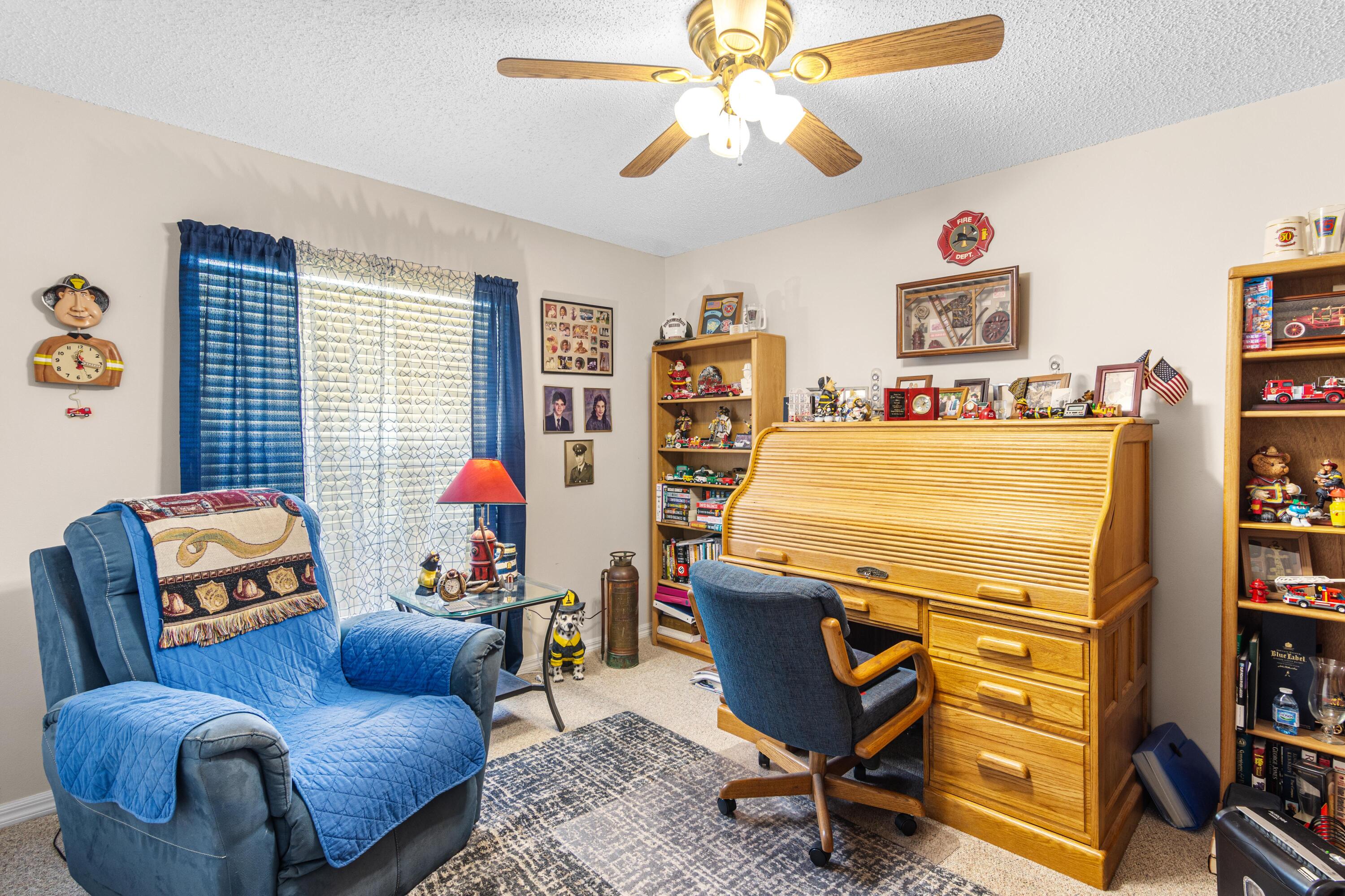 1817 Southwest Davis Street Port St. Lucie, FL 34953 - Photo 17 of 52 a living room with furniture a flat screen tv and a window