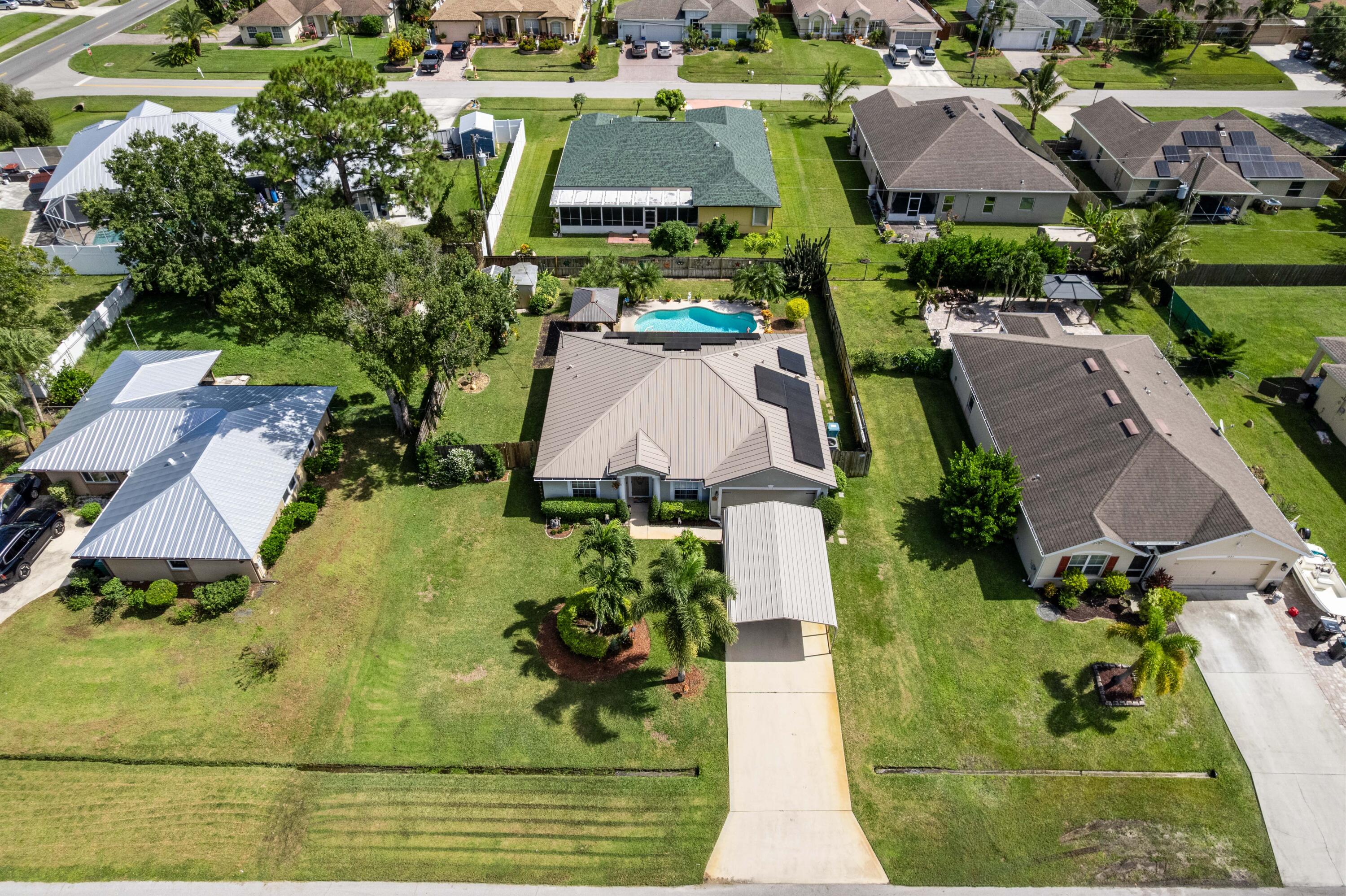1817 Southwest Davis Street Port St. Lucie, FL 34953 - Photo 2 of 52 an aerial view of residential houses with outdoor space