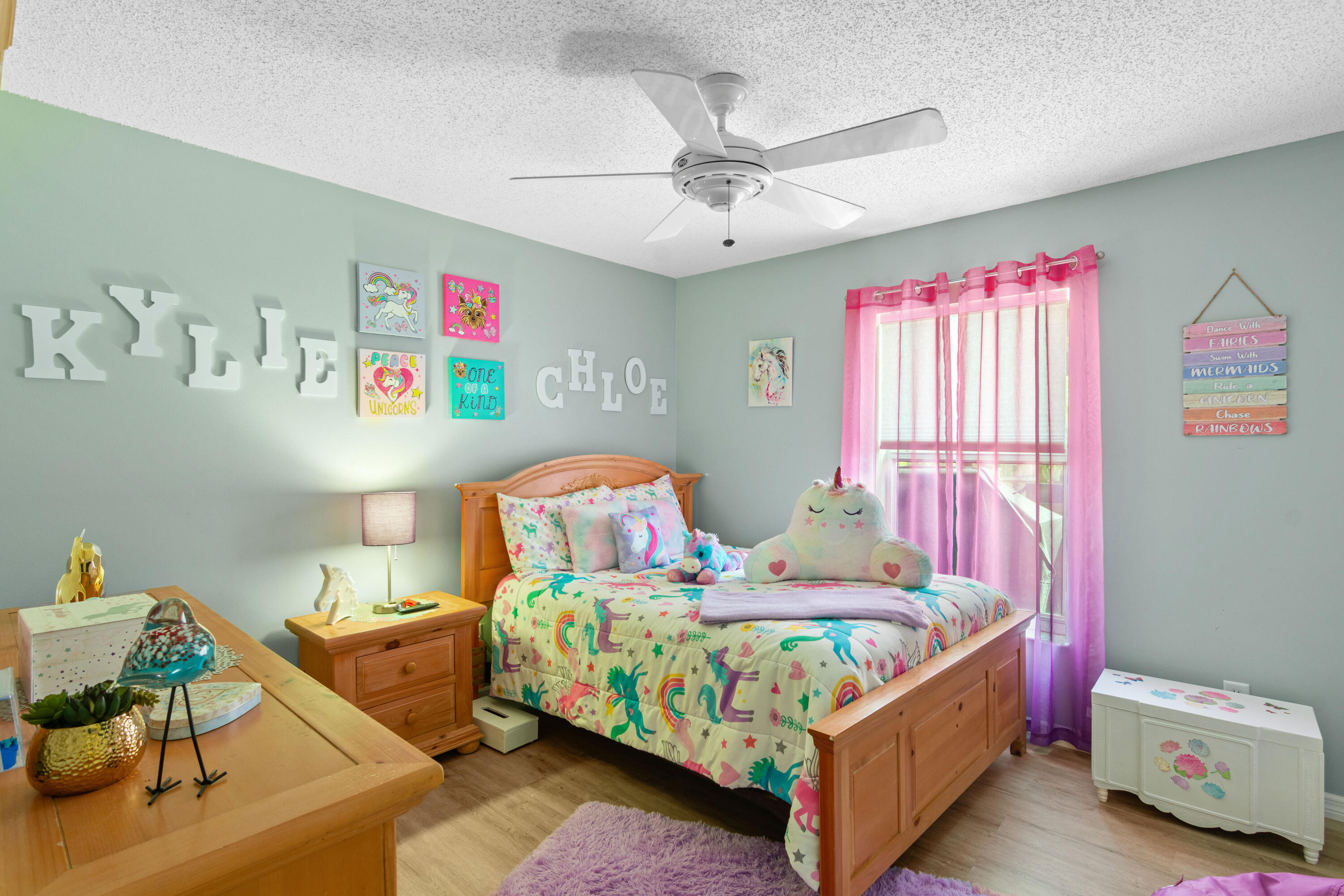 1817 Southwest Davis Street Port St. Lucie, FL 34953 - Photo 22 of 52 a bedroom with a bed and a chandelier