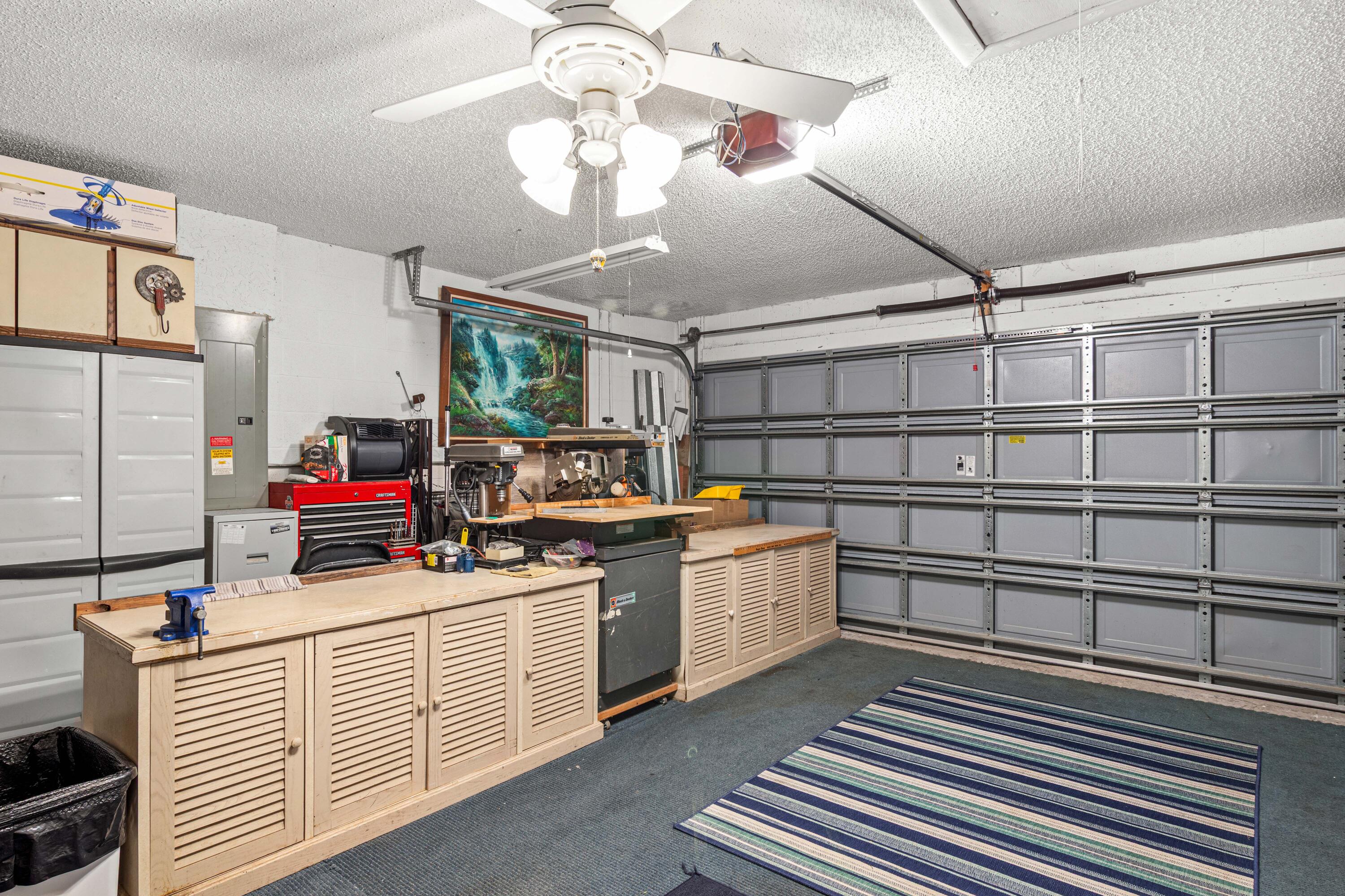 1817 Southwest Davis Street Port St. Lucie, FL 34953 - Photo 29 of 52 a kitchen that has a lot of cabinets in it